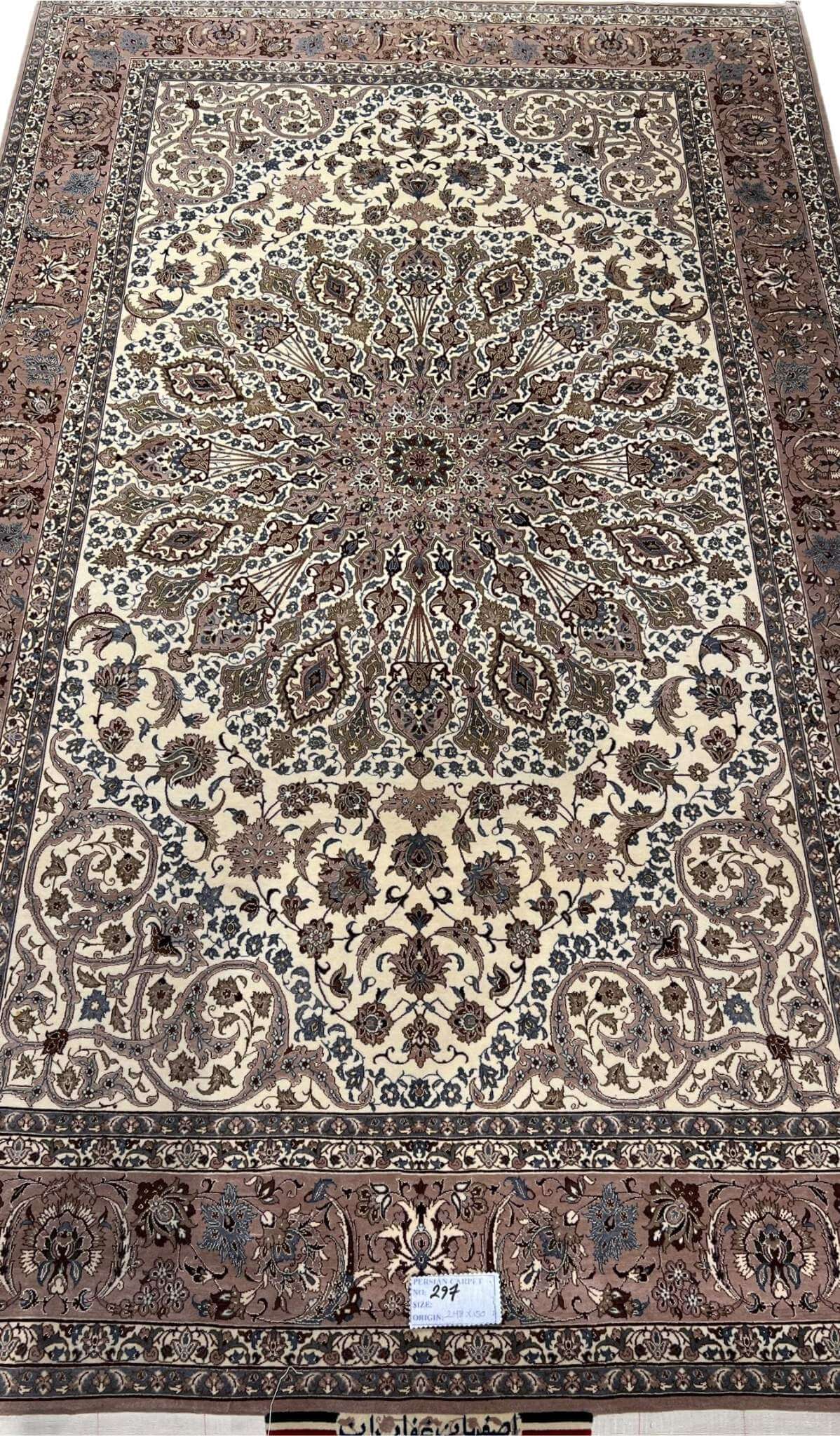 Persian Isfahan rug with central medallion and floral motifs.